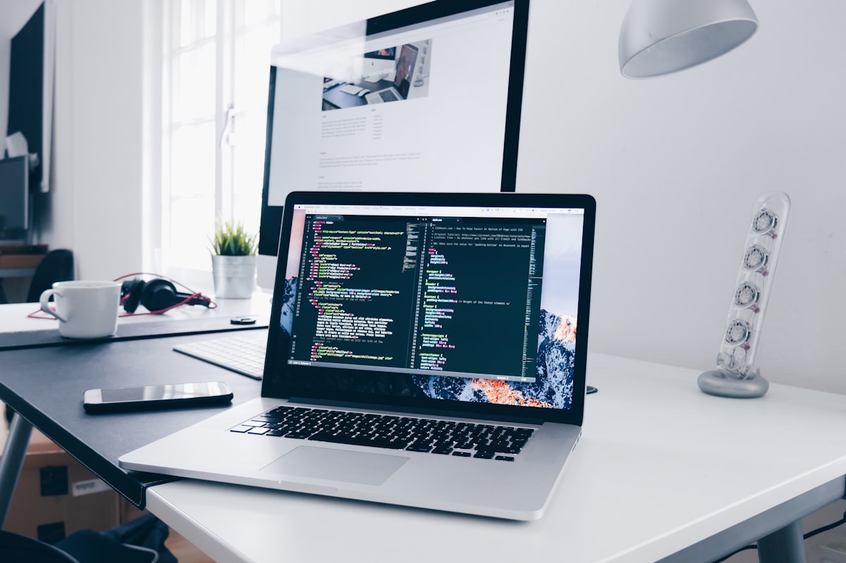 Developer workstation with production software code on screen